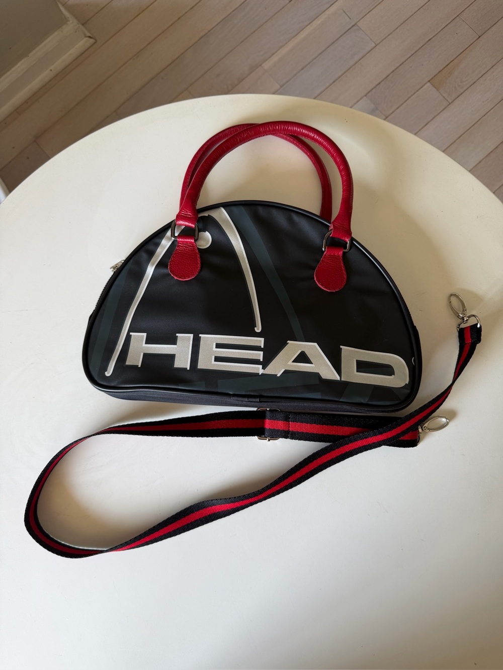 HEAD Black and Red Dome Handbag with Striped Strap